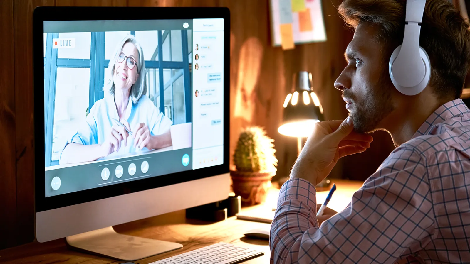 a man watching a webinar on a computer
